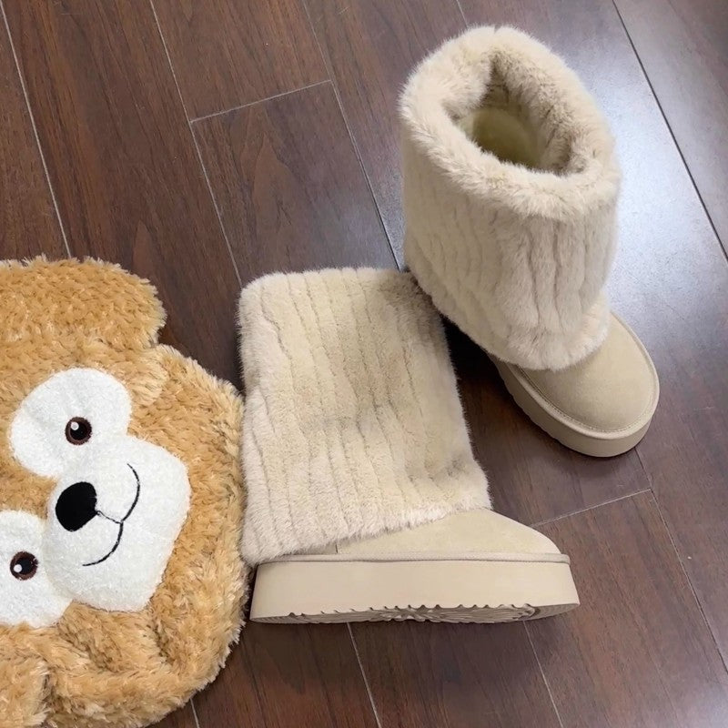 "Step into winter chic with plush, high-top ankle boots. Elevate style with platform comfort. Shop now!" image 10
