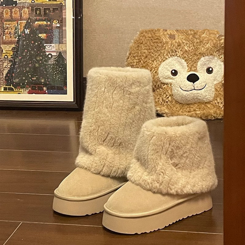 "Step into winter chic with plush, high-top ankle boots. Elevate style with platform comfort. Shop now!" image 1