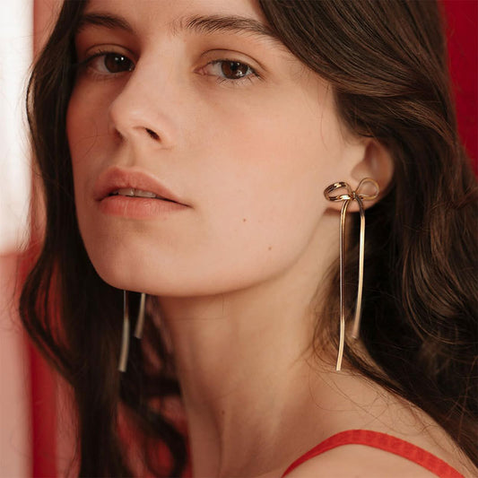 "Elevate your style with Women's Bow Tassel Long Earrings – a perfect blend of elegance and charm." image 1