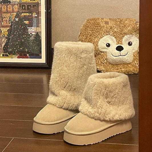 "Step into winter chic with plush, high-top ankle boots. Elevate style with platform comfort. Shop now!" image 1